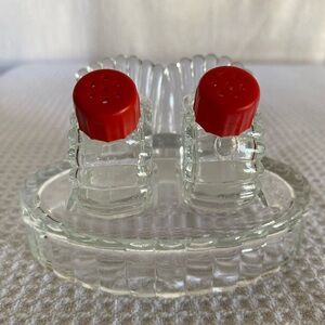 Elegant Pressed Glass Salt and Pepper Shakers with Red Caps